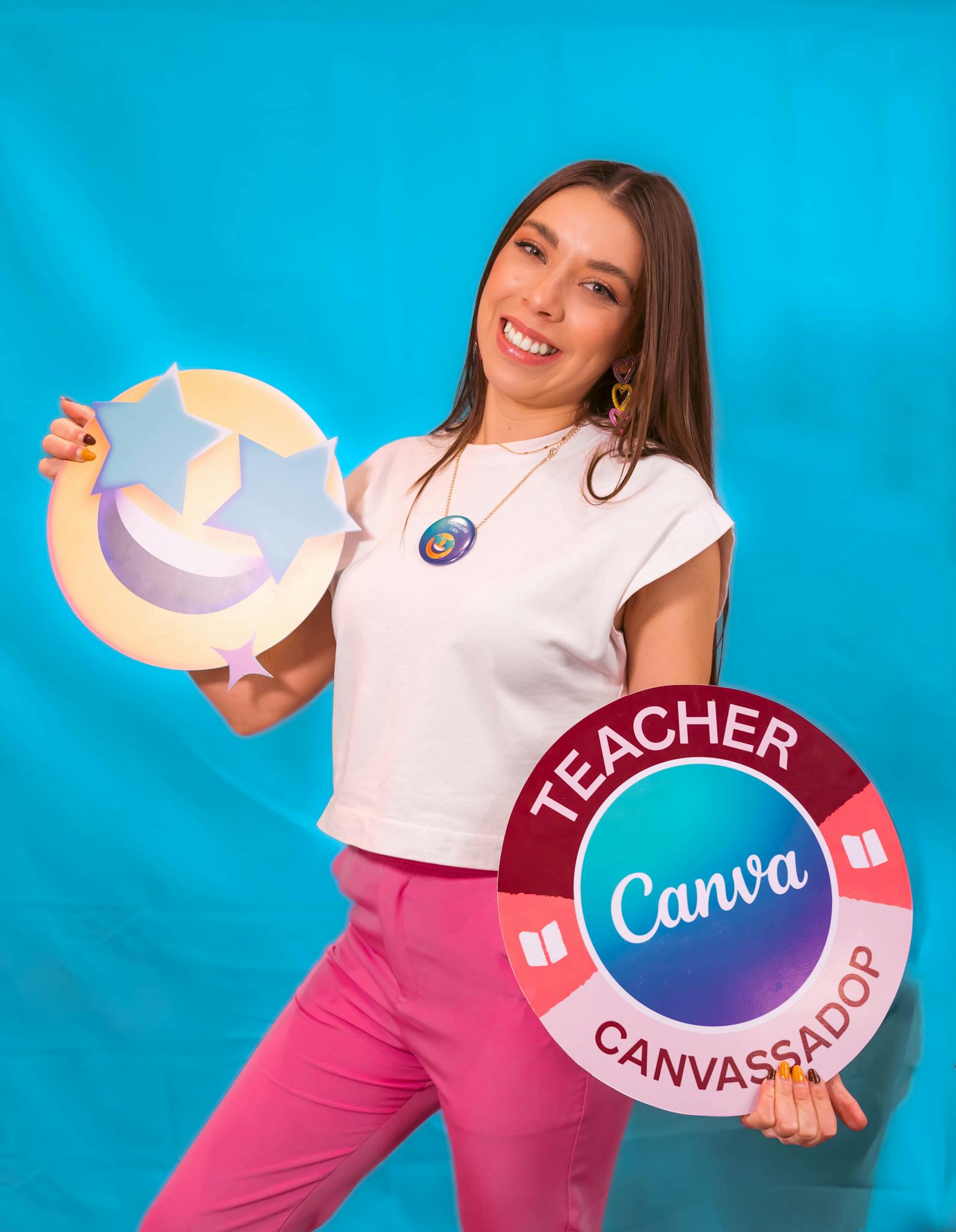 Cheerful woman holding Canva themed props, embracing creativity and teaching spirit.